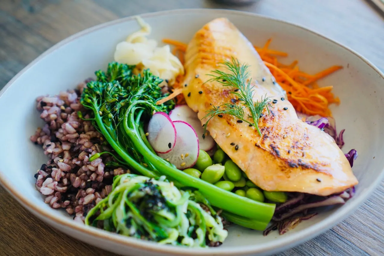 Miso salmon poke bowl with broccolini, edamame, radish and black rice
